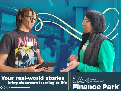 A volunteer discussing average car prices with a student